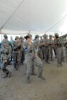Trainees from the 319th Training Squadron kick up their heels during the 2009 Star Spangled Festival at the Lackland Amphitheater grounds. The trainees are doing the Boot Scootin' Boogie. (U.S. Air Force photo/Alan Boedeker) 
