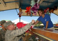 Trainee Robert Stroms, 321st Training Squadron, Flight 477, wins a pink gorilla at the carnival during the 31st annual Star Spangled Festival July 4.                                