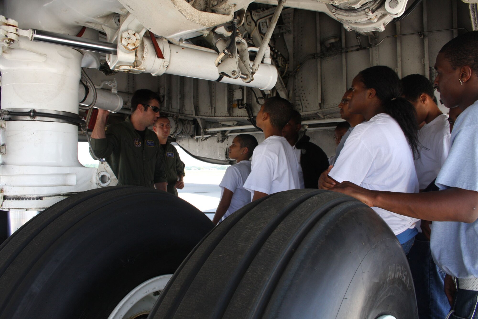 WRIGHT-PATTERSON AIR FORCE BASE, Ohio – Staff Sgt. Eugene Mehaffy, left, and Staff Sgt. Grant Thurmond, 89th Airlift Squadron, show 45 students from the Buckeye Tigers Aviation Career Enhancement (ACE) Academy Camp around a C-5 Galaxy. The academy, a program sponsored by the City of Refuge Point of Impact, Inc., is a Columbus, Ohio, based non-profit organization, in collaboration with the Columbus Buckeye Tigers, a youth aviation group attached to the National Organization of Black Airline Pilots.  (Air Force photo/Senior Airman Mikhail Berlin)