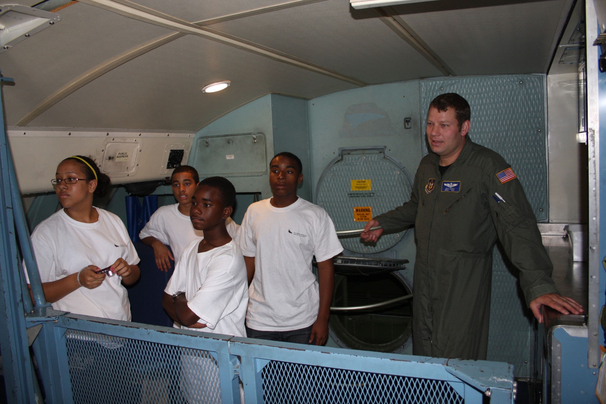 WRIGHT-PATTERSON AIR FORCE BASE, Ohio – Master Sgt. Jeff Liechty, 89th Airlift Squadron, gives 45 students from the Buckeye Tigers Aviation Career Enhancement (ACE) Academy Camp a tour of the troop compartment of a C-5 Galaxy.  The academy, a program sponsored by the City of Refuge Point of Impact, Inc., is a Columbus, Ohio, based non-profit organization, in collaboration with the Columbus Buckeye Tigers, a youth aviation group attached to the National Organization of Black Airline Pilots.  (Air Force photo/Senior Airman Mikhail Berlin)