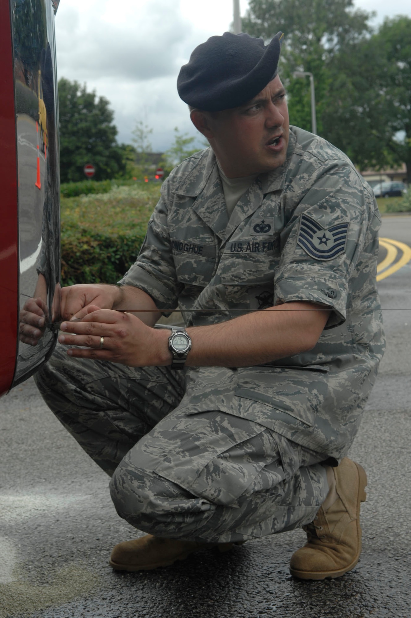 Tech. Sgt. Bradley Donoghue takes measurements at the scene of a major vehicle accident on RAF Mildenhall, England, July 8. The 4,000-gallon water tanker rolled onto its side near the roundabout on Hawaii Street. Sergeant Donoghue is a member of the 100th Security Forces Squadron’s accident investigation team that will analyze what occurred. The driver and sole occupant received minor injuries. He was treated at the scene and driven by ambulance to RAF Lakenheath Hospital for examination. (U.S. Air Force photo by Senior Airman Thomas Trower)