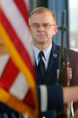 Chief Master Sgt. Arvin Davis stands at attention during the colors presentation at his retirement ceremony at the U.S. Air Force Academy, Colo., June 5. Chief Davis, the former command chief for the Academy, said he plans to head back to the East Coast, where his Air Force adventure started in June 1980. (U.S. Air Force photo/Mike Kaplan)