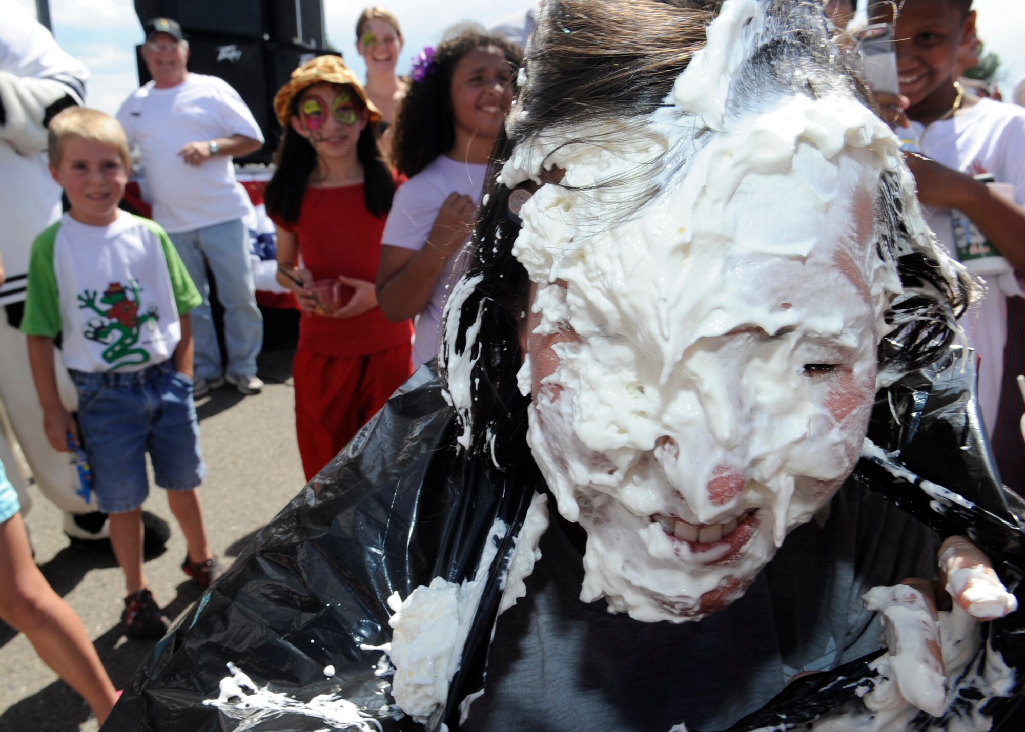 BUCKLEY AIR FORCE BASE, Colo. – Master Sgt. Deanna Snider, 460th Mission Support Group first sergeant takes a pie to the face to support Airmen Against Drunk Driving during Freedom Fest here, July 1.  The celebration included food, events for children and a live band. (U.S. Air Force photo by Tech. Sgt. Jeromy Cross)