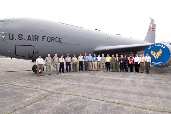 HANSCOM AIR FORCE BASE, Mass. -- Personnel from the Senior Leadership C3 System - Airborne Communications Program office line up in front of a modified KC-135 known as Test Tanker II June 30. The program team will use Test Tanker II to test standardized command, control and communications (C3) equipment that will be incorporated on a special fleet of aircraft used to transport senior U.S. officials. (Air Force photo by Rick Berry) 