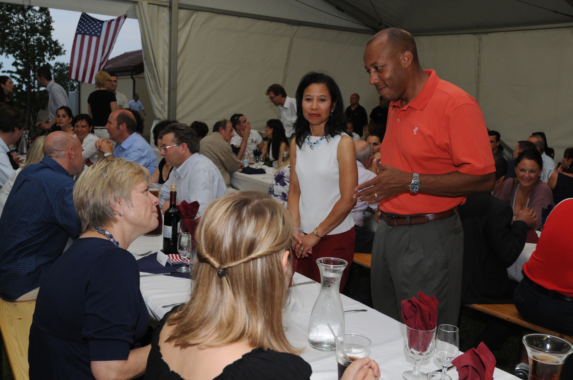 Colonel Charles Q. Brown Jr. (right), 31st Fighter Wing Commander, speaks with Carol Z. Perez, United States Consul General for the Milan District, during a social and dinner event here during the 4th of July Celebration. The social and dinner brought together base leadership, squadron commanders,  local officials, and Honorary Squadron Commanders during the  4th of July Celebration. (U.S. Air Force photo/ Staff Sgt. Patrick Dixon)