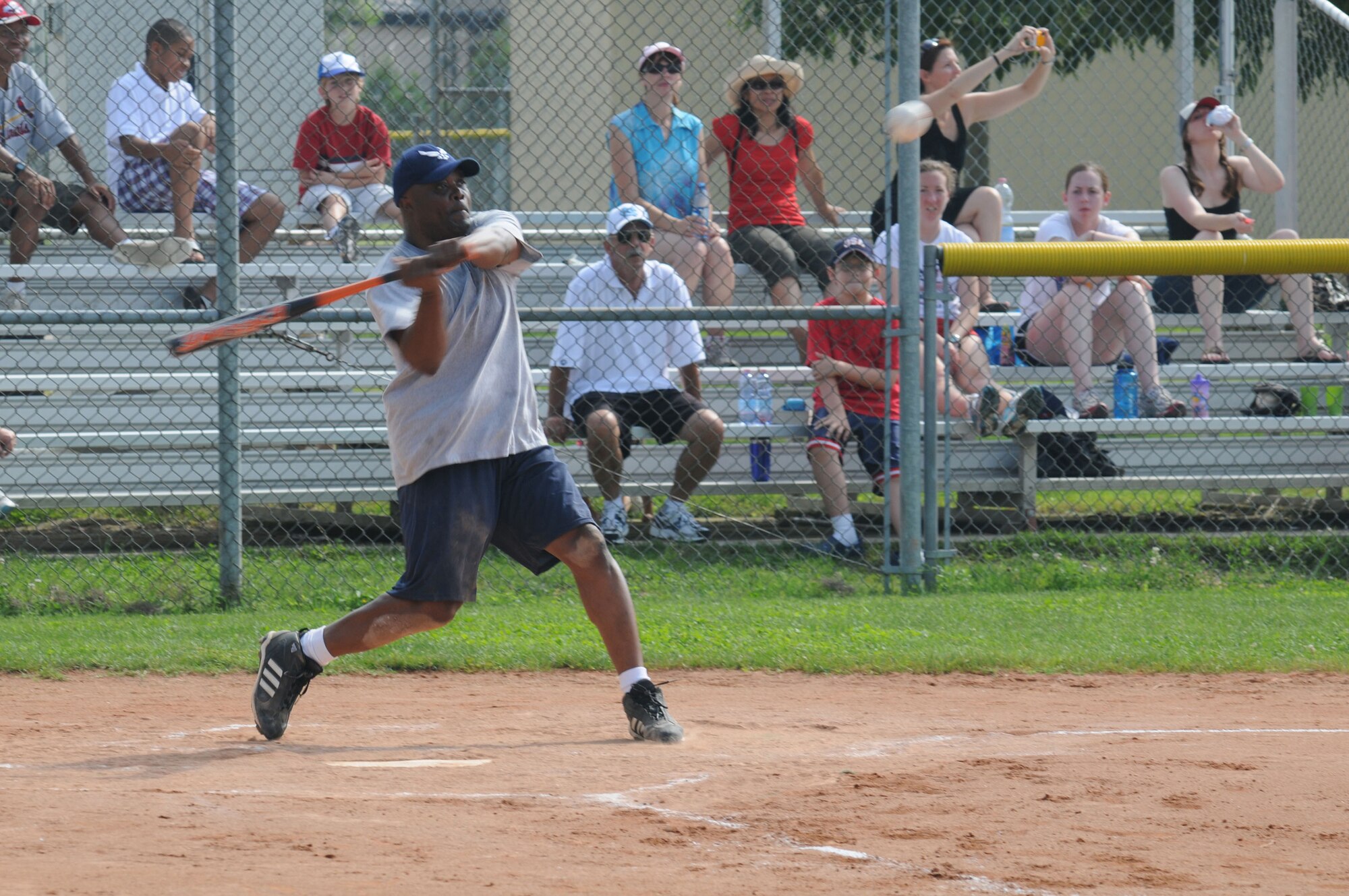 Chief Master Sgt. Brian Miller swings at a softball during the Chief versus Eagles game here during the 4th of July Celebration. The 4th of July Celebration consisted of various events throughout the day and concluded with a fireworks display at night commemorating 233 years of Independence. The Eagle's team ,consisting of base leadership and squadron commanders, won the game 12 to 5. (U.S. Air Force photo/ Staff Sgt. Patrick Dixon)