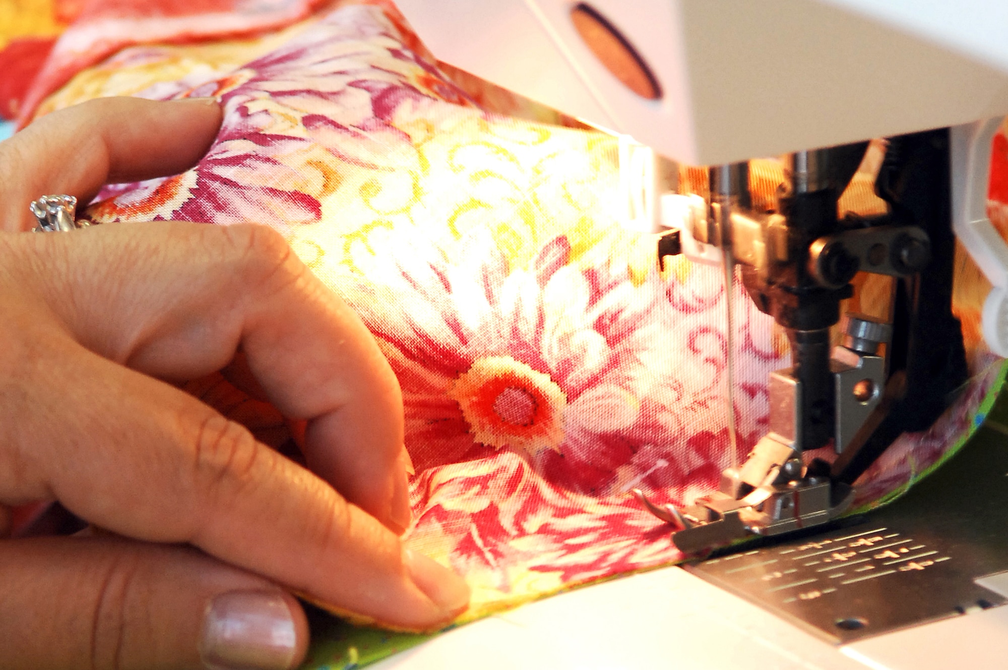 Ms. Clara Monica Blackburn, member of the Rheinland-Pfalz Quilt Guild sews a border on a quilt she’s making for her daughter on June 26, 2009, Ramstein Air Base, Germany.  The quilt guild is a non-profit organization that gets together weekly to fellowship and sew. They also create Quilts of Valor for wounded warriors and Baby Love Quilts for babies in the neonatal intensive care unit at Landstuhl Regional Medical Center.  (U.S. Air Force photo by Tech. Sgt. Chenzira Mallory)