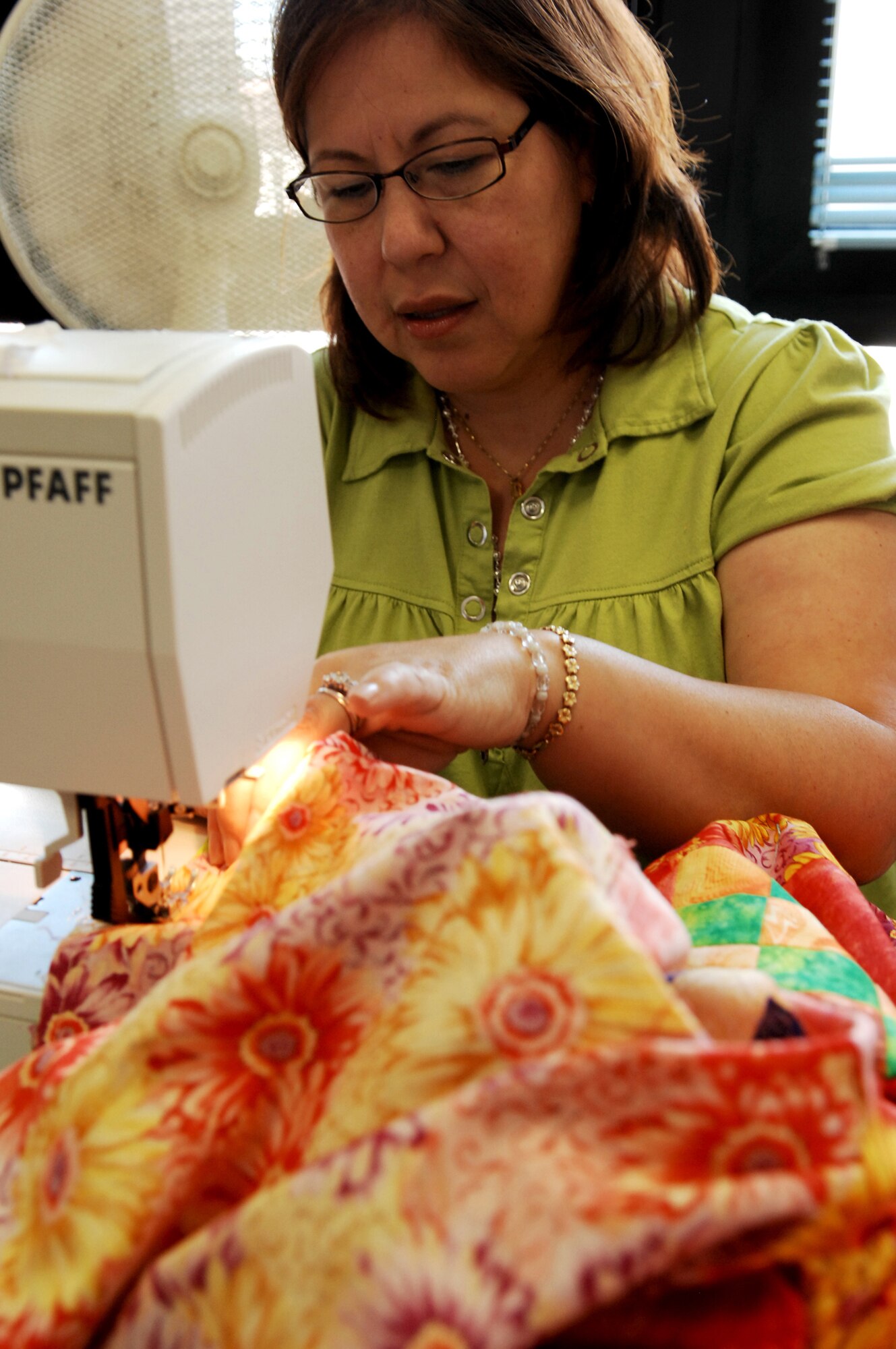 Ms. Clara Monica Blackburn, member of the Rheinland-Pfalz Quilt Guild sews a border on a quilt she’s making for her daughter on June 26, 2009, Ramstein Air Base, Germany.  The quilt guild is a non-profit organization that gets together weekly to fellowship and sew. They also create Quilts of Valor for wounded warriors and Baby Love Quilts for babies in the neonatal intensive care unit at Landstuhl Regional Medical Center.  (U.S. Air Force photo by Tech. Sgt. Chenzira Mallory)