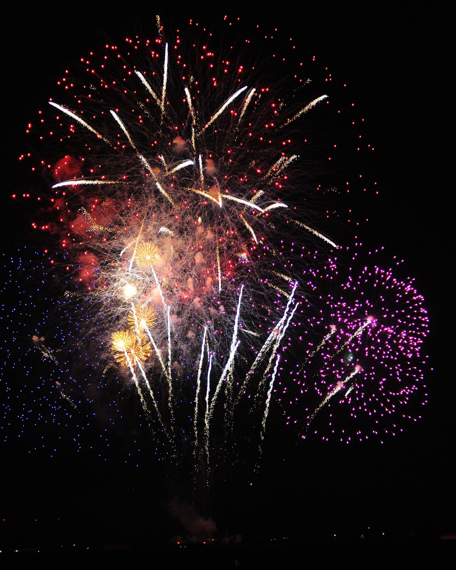 YOKOTA AIR BASE, Japan -- YOKOTA AIR BASE, Japan - Fireworks burst over Yokota Air Base July 4.  The 374th Force Support Squadron provided Yokota residents and their guest with events for all ages. The day kicked off with the Firecracker 5K run and a wide variety of activities throughout the day to include go-carts, petting zoo, live entertainment, food and fireworks. (U.S. Air Force photo/Airman 1st Class Michael Dillon) 