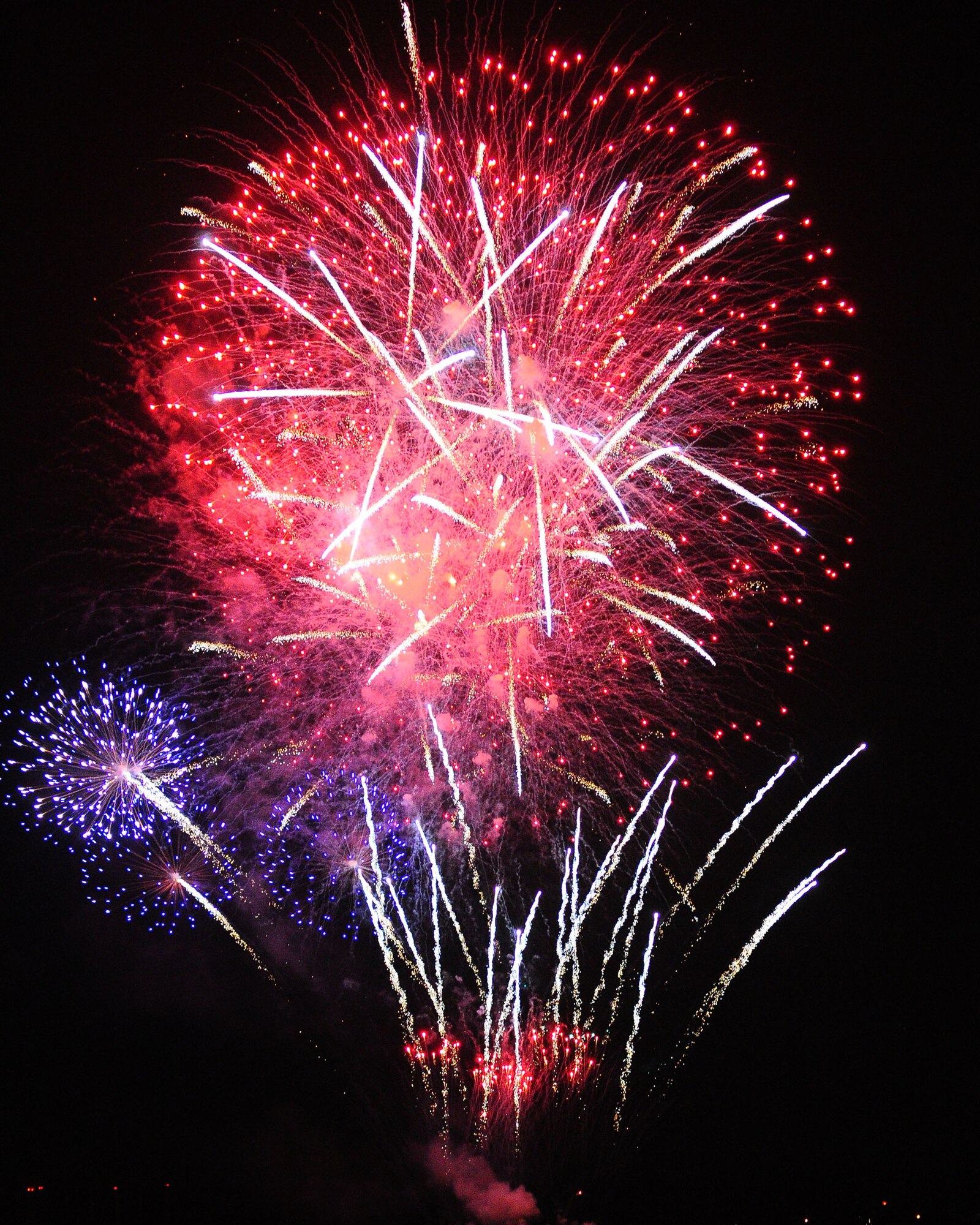 YOKOTA AIR BASE, Japan -- YOKOTA AIR BASE, Japan - Fireworks burst over Yokota Air Base July 4.  The 374th Force Support Squadron provided Yokota residents and their guest with events for all ages. The day kicked off with the Firecracker 5K run and a wide variety of activities throughout the day to include go-carts, petting zoo, live entertainment, food and fireworks. (U.S. Air Force photo/Airman 1st Class Michael Dillon) 