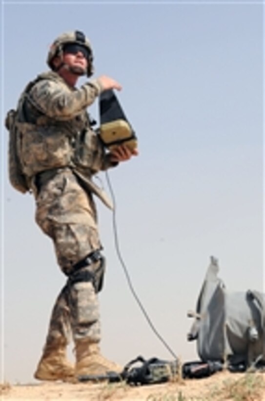 U.S. Army Spc. Corey Weinheimer with 5th Squadron, 73rd Cavalry Regiment, 3rd Brigade Combat Team, 82nd Airborne Division controls a Raven unmanned aerial vehicle during a joint air assault operation planned and led by the Iraqi army and Iraqi National Police in the Ma'dain area east of Baghdad, Iraq, on June 26, 2009.  The Raven is being used to provide real time observation of the objective during a search for weapons caches and insurgent activity.  