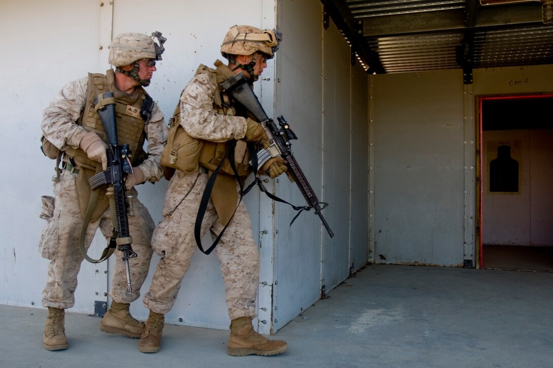 Marines of 3rd Platoon, Alpha Company, 1/3, spent much of their day July 8 training as pairs and four-man fire teams to make dynamic entries into doorways at the Range 1 "shoot house."