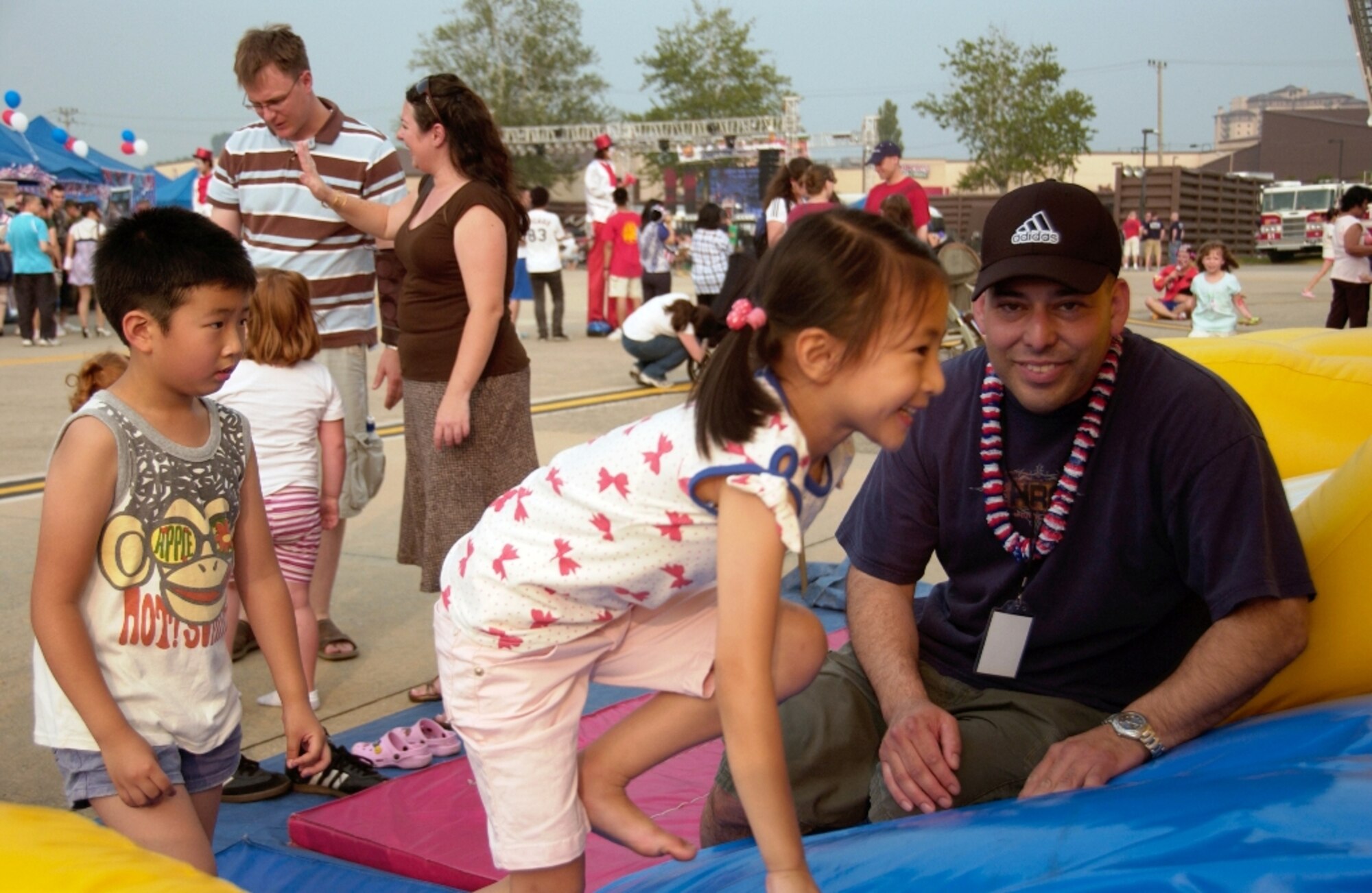 Members of Team Osan, along with the local community, enjoy themselves during the 2009 Liberty Fest hosted by the 51st Force Support Squadron. Among some of the annual Independence Day activities included Korean cultural dancing, Korean drums and entertainment, live bands, break dancing performance, dunking booth, aircraft static displays and the night’s grand finale, of a fireworks.  (U.S. Air Force photo/Tech. Sgt. Raymond Winstead)