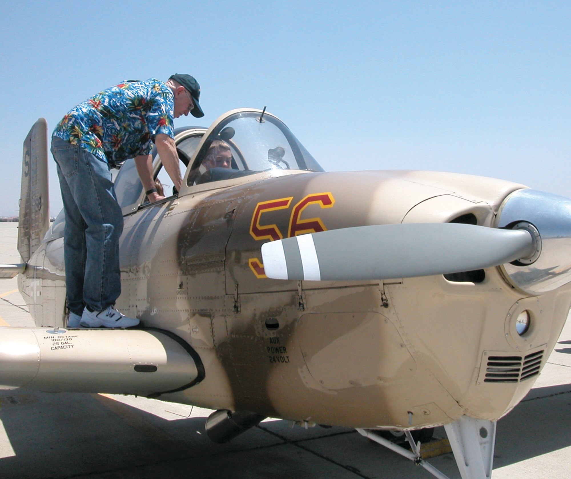 Bob Pearce conducts mini-ground school with JROTC cadets during their afternoon at the Aero Club on June 26. Each student had about five minutes in the cockpit of one of the Aero Club’s planes. (U.S. Air Force photo by Megan Just)