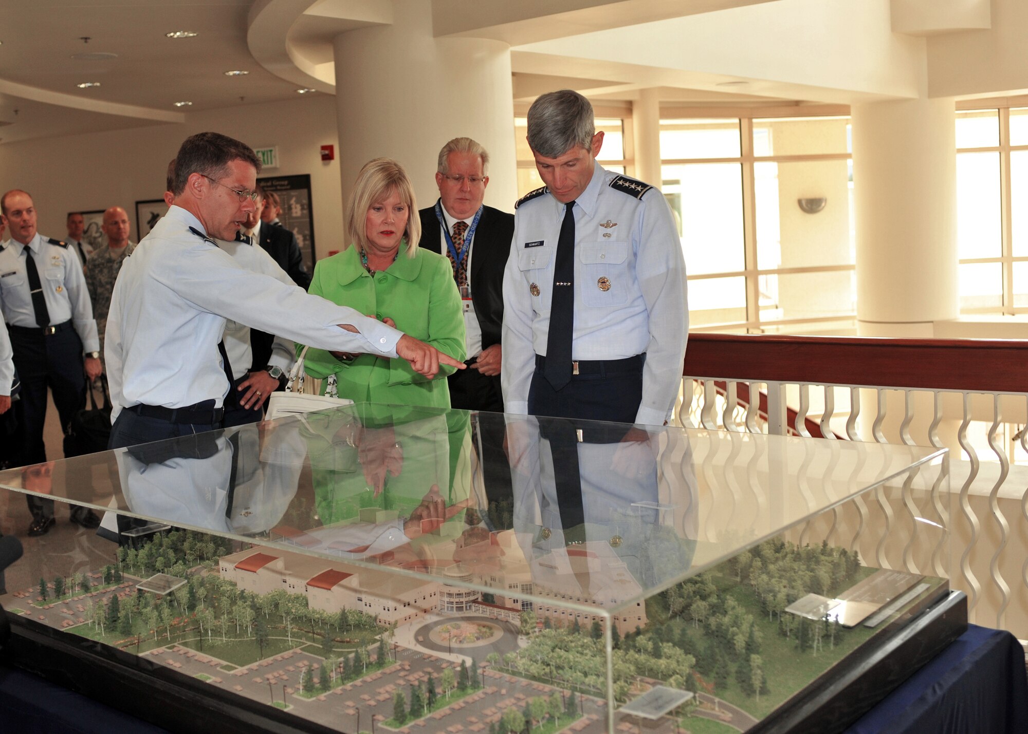 Col. Paul Friedrichs, 3rd Medical Group commander, shows Air Force Chief of Staff Gen. Norton Schwartz and Mrs. Schwartz a model of the base hospital July 6 during their visit to Elmendorf Air Force Base, Alaska. The hospital has won Best Hospital in the Air Force two years in a row.  Also observing the display is Alex Spector, Alaska's Veteran Affairs director. (U.S. Air Force photo/Senior Airman Laura Turner)