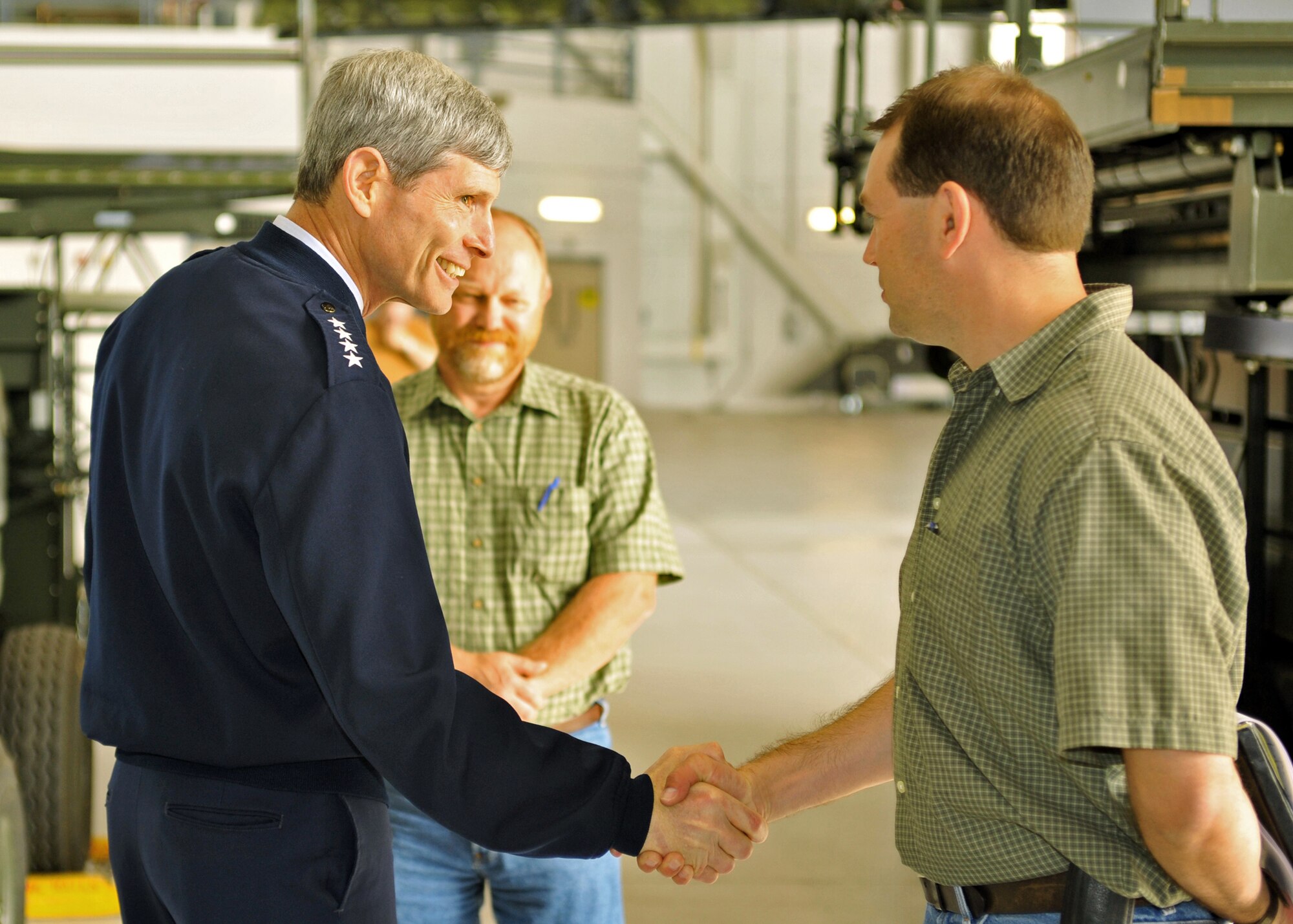 Air Force Chief of Staff Gen. Norton Schwartz chats with Shawn Moser (right), 3rd Civil Engineer Squadron project manager, and Bob McElroy, 3rd CES construction manager, July 6 during his visit to Elmendorf Air Force Base, Alaska. (U.S. Air Force photo/Senior Airman Laura Turner)