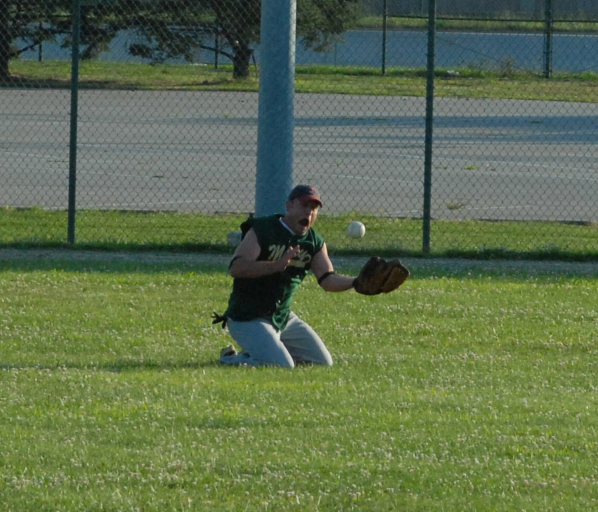 Lee Sebulsky, 436th Comptroller Squadron, makes a diving catch in center field during an intramural softball game against the Air Force Mortuary Affairs Operations Center July 7.   AFMAO defeated 436th CPTS 13-3.  (US Air Force photo/Staff Sgt. Chad Padgett)