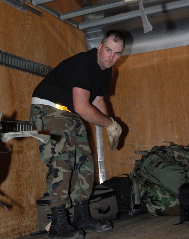 Tech. Sgt. Randall Tindle, Communications Flight, was one of several volunteers on the baggage detail during the ORI’s initial response. (photo by Tech. Sgt. Mandy Johnson)