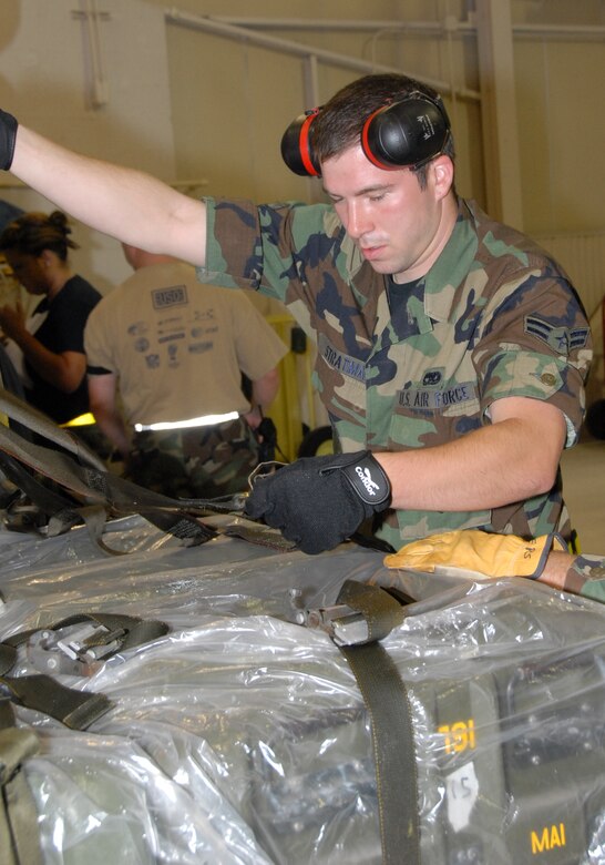 Airman 1st Class Andrew Stratman inspects cargo deploying to the ORI.  190th members processed more than 60 tons of cargo during the initial response.
(photo by Tech. Sgt. Mandy Johnson)