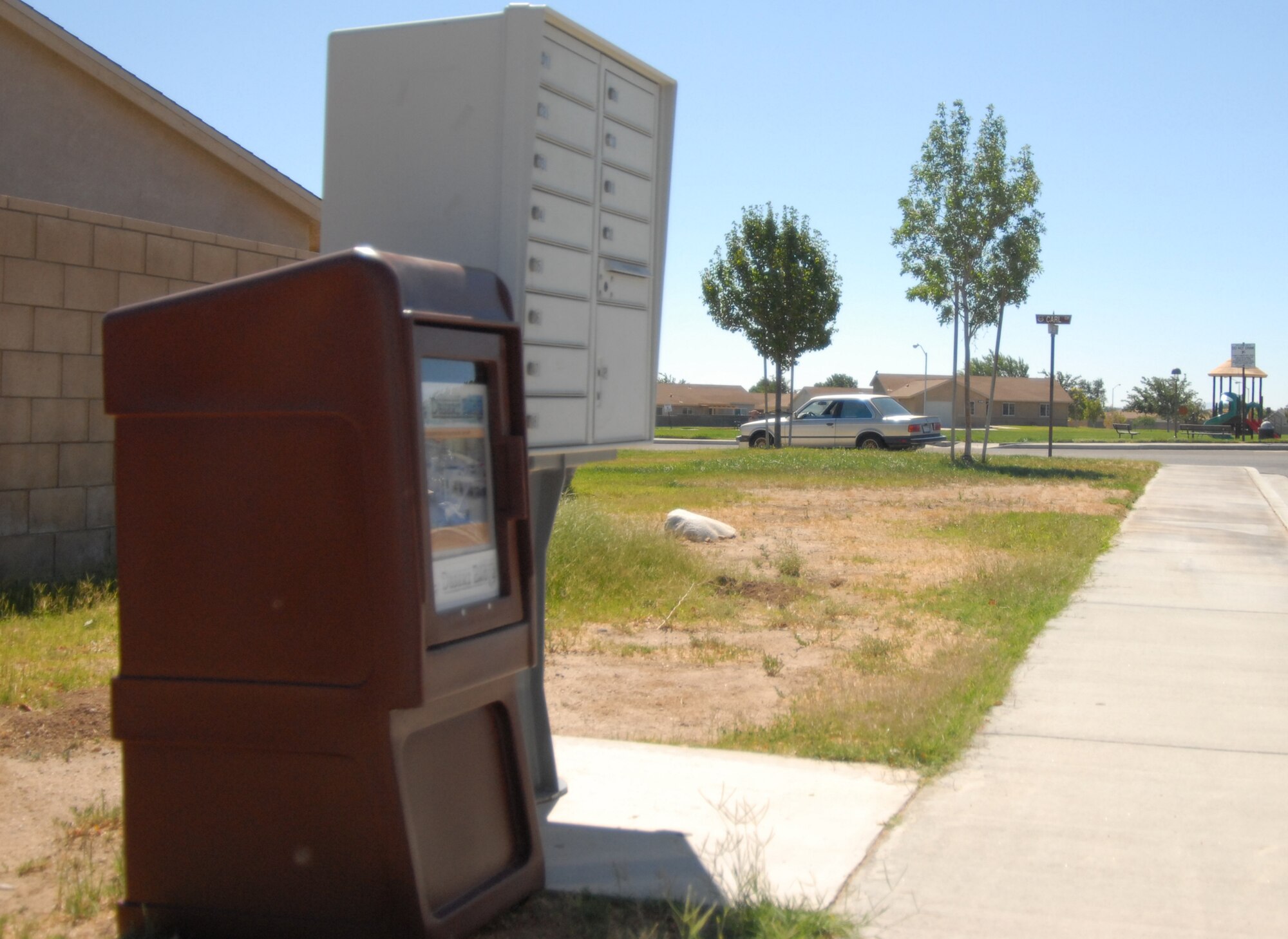 With the installation of new newspaper stands located at many of the mailboxes in base housing, residents will now be able to get the weekly newspaper when they go get their mail. (Air Force photo/2nd Lieutenant Belena Marquez) 
