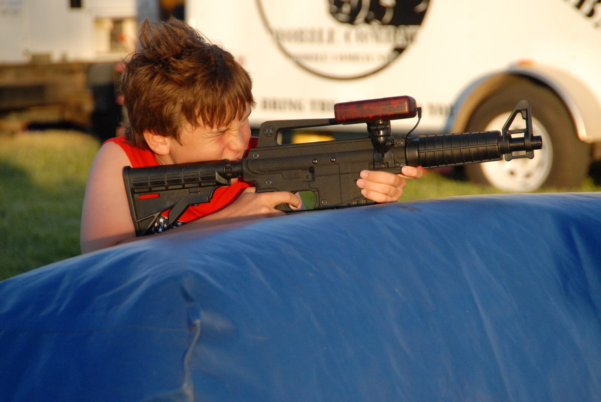 A Summer Bash participant takes part in a game of laser tag during Summer Bash at Wings and Robert Fields here July 4. Attended by hundreds, Summer Bash offered all base personnel an event to celebrate and reflect on the country's heritage. (Air Force photo/Airman 1st Class Devon Sumter)