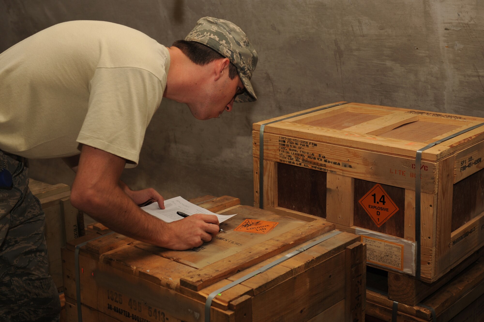Senior Airman Michael Womer, 4th Equipment Maintenance Squadron munitions systems journeyman, validates markings on a munitions container while checking inventory in a bunker on Seymour Johnson Air Force Base, N.C., July 7, 2009. The 4th EMS has maintained 100 percent accountability of its munitions for more than 40 years. (U.S. Air Force photo by Airman 1st Class Whitney S. Lambert) 