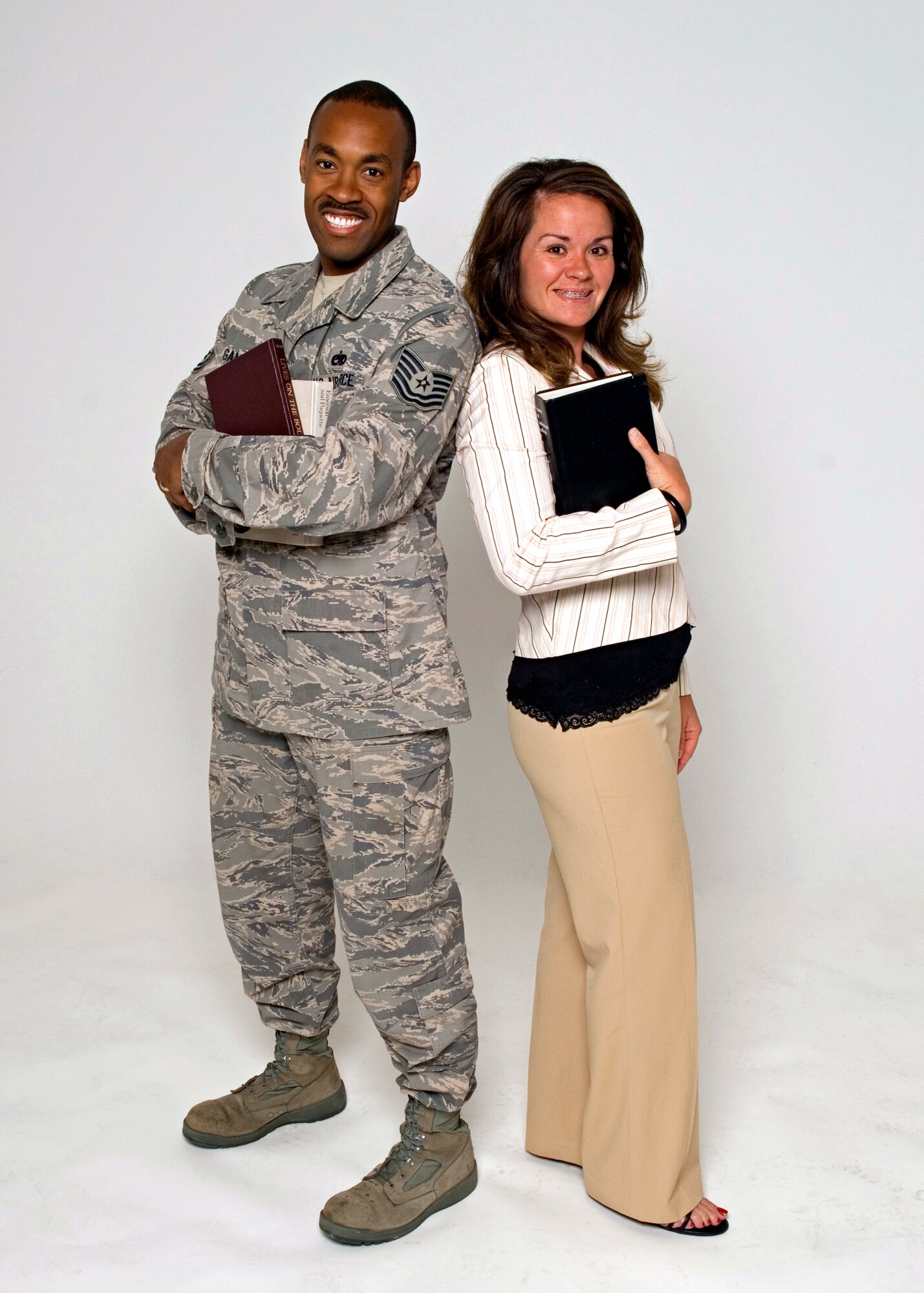 Tech. Sgt. Joe Gambles, 31st Test and Evaluation Squadron Global Hawk aircraft lead evaluator, and his wife, Danielle supported each other and realized their dreams of getting degrees. (Air Force photo/Edward Cannon)