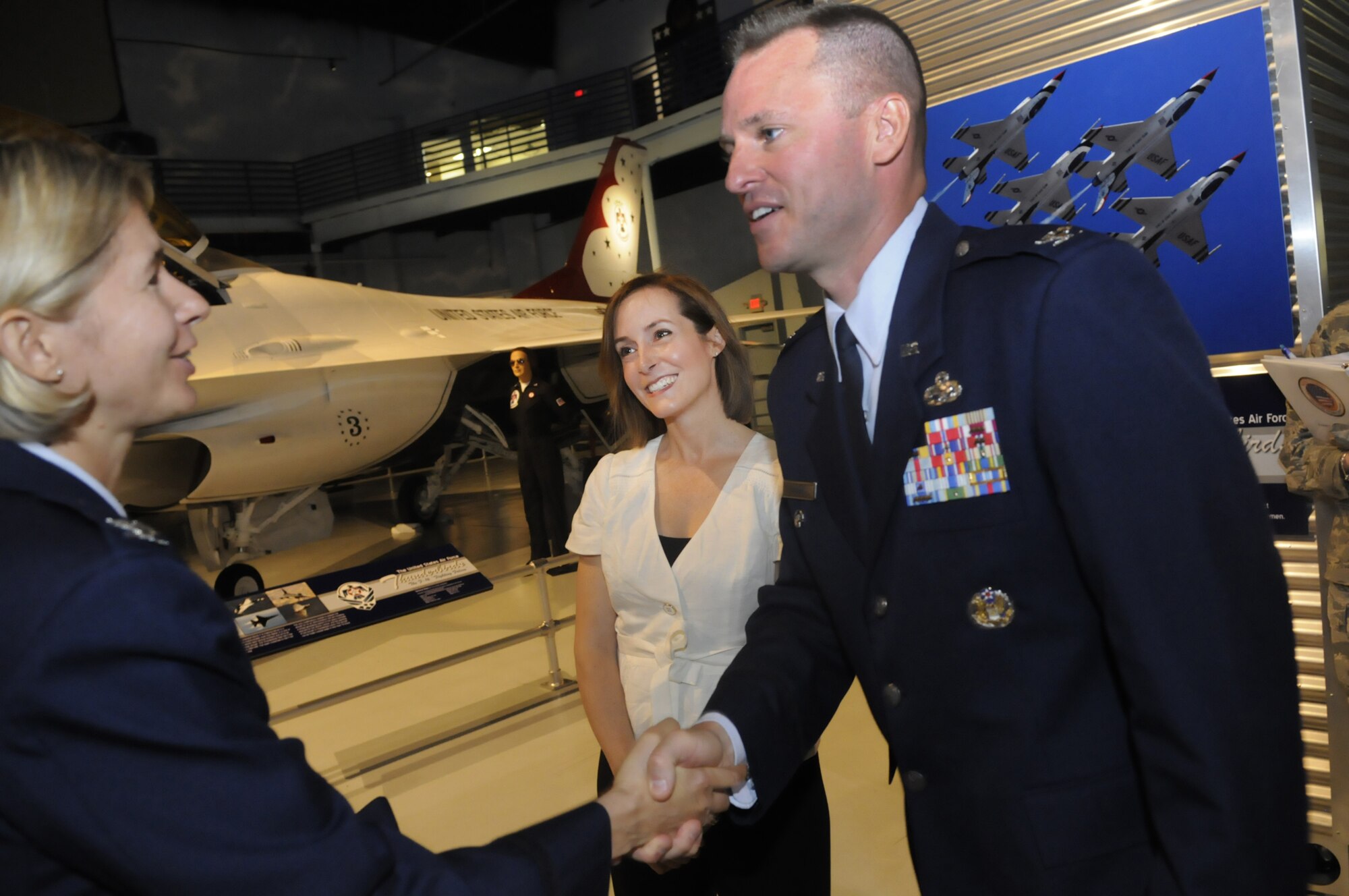 Col. Lee-Ann Perkins, 78th MSG commander, left, greets Col. Carl Buhler, new 78th Air Base Wing commander and his wife Shannon after the change of command ceremony July 7. U. S. Air Force photo by Sue Sapp