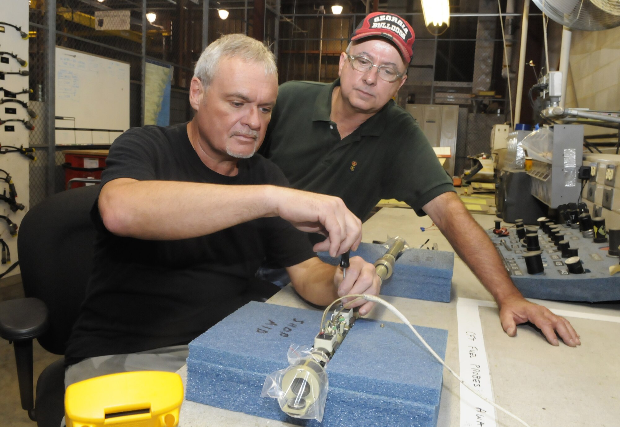Dirk May, left, James Broadnax and Charles Ray (not pictured) of the 402nd Maintenance Wing shared in a $9,817 award for an innovative idea. U. S. Air Force photo by Sue Sapp