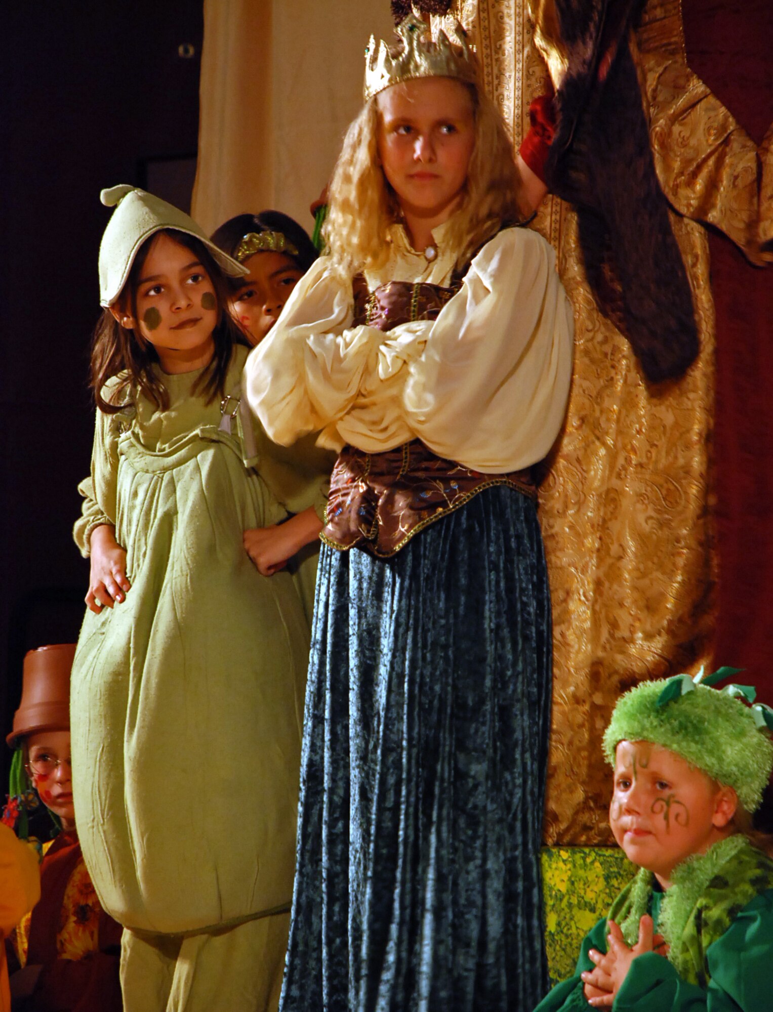 LAUGHLIN AIR FORCE BASE, Texas –– Sabrina Shrum,11, daughter of Tanya and Maj. Rory Shrum, 96 Flying Training Squadron, and Lily Shandersky, daughter of Ingrid and Maj. Christopher Shandersky, 84th Flying Training Squadron,  plays the Pea and the Princess during a performance of The Princess and the Pea at Losano Fitness Center here June 26. The play was the final product after the young XLers went through weeks of auditioning, casting and practicing with members of the Missoula Children’s Theatre. (U.S. Air Force photo by Airman 1st Class Sara Csurilla)
