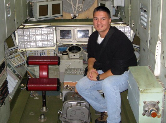Dr. Kjell Lindgren trains inside a mockup of the Mir space station in October 2008. Dr. Lindgren, an aerospace physician and 1995 graduate of the U.S. Air Force Academy in Colorado Springs, Colo., was one of two Academy alumni selected for NASA's 2009 astronaut candidate class. (U.S. Air Force photo)