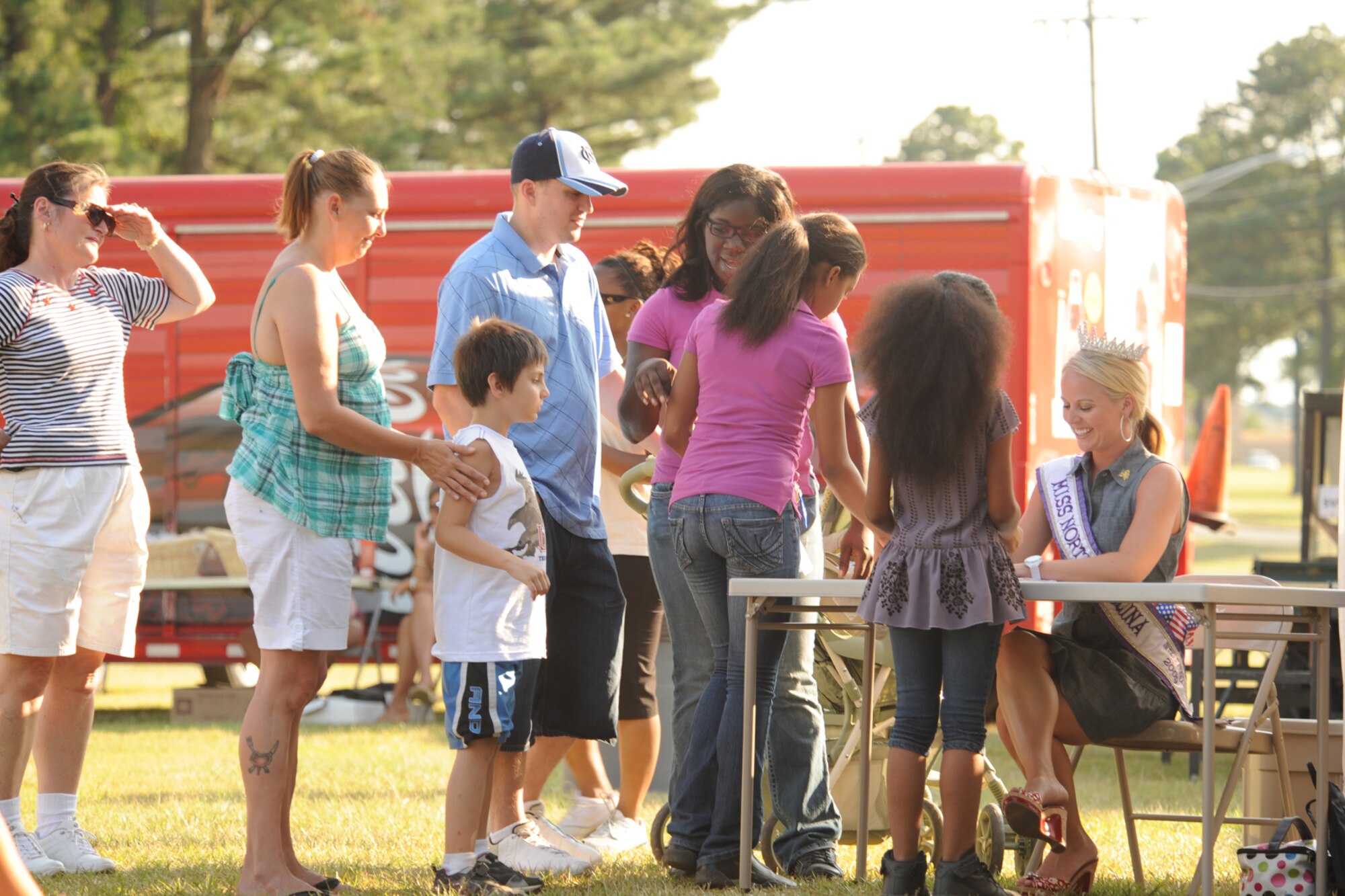 Miss North Carolina International Julie Tesh signs autographs during the Celebration of Freedom, a 4th of July event, on Seymour Johnson Air Force Base, N.C., July 2, 2009. Miss Tesh took pictures, answered questions from fans and thanked Airmen for protecting the nation. (U.S. Air Force photo by Airman 1st Class Whitney S. Lambert)
