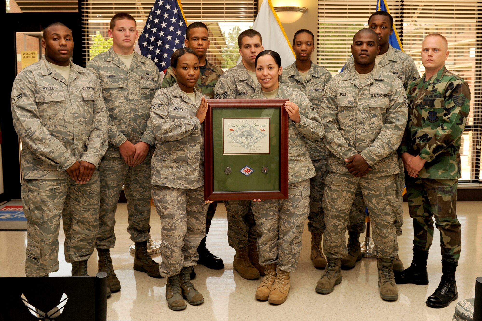 The Little Rock Air Force Base Honor Guard displays the Arkansas Army National Guard Diamond Award during an awards ceremony June 30, 2009 at the Hercules Dining Facility. The award was presented to the base Honor Guard by the Arkansas Army National Guard for their support of providing a final means of respect to fallen Army servicemembers. (U.S. Air Force photo by Airman Lausanne Pacheco)