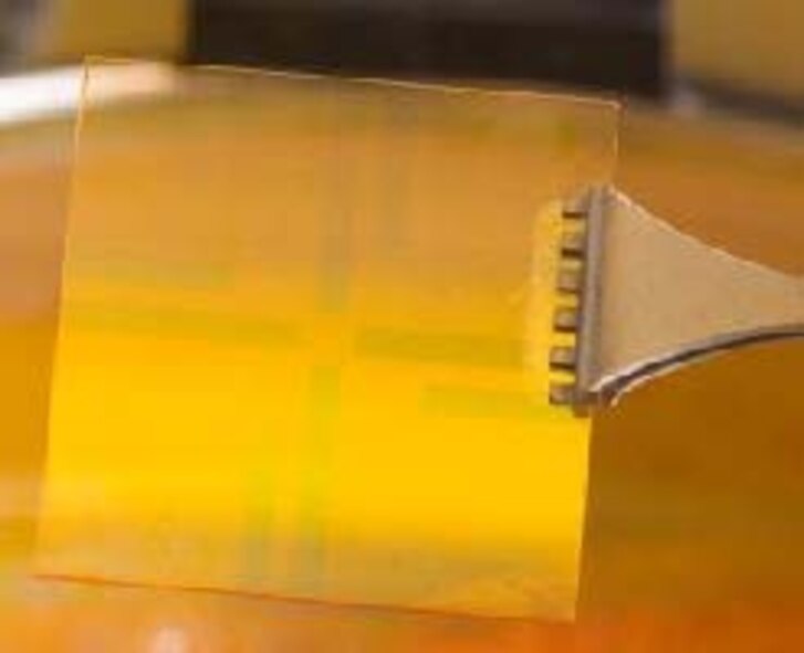Plexcore® technology, depicted here, allows solar cells to form-fit soldiers’ uniforms to power GPS components and communication devices, and could also be used to “print” solar panels onto thin films incorporated into military tents. Commercial applications include solar energy batteries for cell phones, radios, and other portable devices. (U.S. Air Force photo)