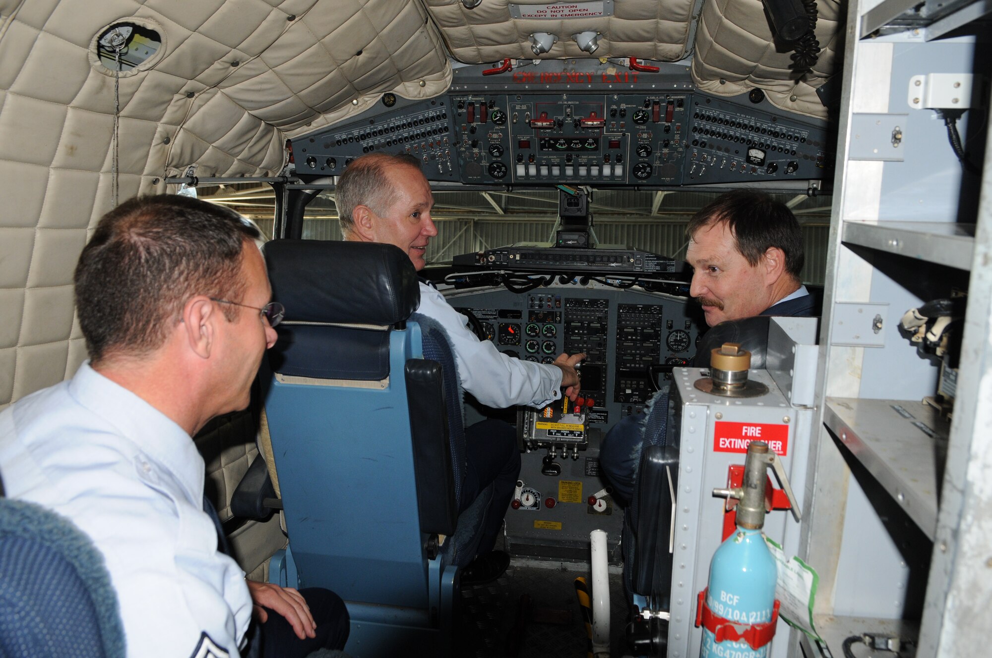 Maj. Gen. Ron Ladnier and CMSgt. Timothy Steffen, commander and command chief for Air Forces Africa, explore the cockpit of a South African C-47 Dakota as Lt. Col. M. Engelbrecht, officer commanding, 35 Squadron, describes the mission of their maritime patrol aircraft.