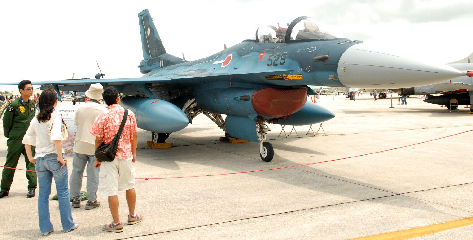 Okinawans get a glimpse of a Japanese Defense Force fighter aircraft during AmericaFest 09' at Kadena Air Base July 4th. (U.S. Air Force photo/Junko Kinjo)     