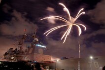 NAVAL AIR STATION PEARL HARBOR, Hawaii -- Fireworks erupt into a shower of colors behind the USS LAKE ERIE (CG 70), an Aegis-class guided missile cruiser based at Naval Station Pearl Harbor during the July 4 Celebration of Lights fireworks show. The day-long celebration was filled with live entertainment, exotic car display, a car show, pony rides, petting zoo, radio controlled car racing, games and much more. (U.S. Air Force photo by Staff Sgt. Mike Meares)  