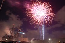 NAVAL AIR STATION PEARL HARBOR, Hawaii -- Fireworks erupt into a shower of colors behind the USS LAKE ERIE (CG 70), an Aegis-class guided missile cruiser based at Naval Station Pearl Harbor during the July 4 Celebration of Lights fireworks show. The day-long celebration was filled with live entertainment, exotic car display, a car show, pony rides, petting zoo, radio controlled car racing, games and much more. (U.S. Air Force photo by Staff Sgt. Mike Meares)  