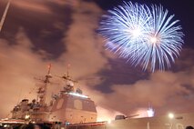 NAVAL AIR STATION PEARL HARBOR, Hawaii -- Fireworks erupt into a shower of colors behind the USS LAKE ERIE (CG 70), an Aegis-class guided missile cruiser based at Naval Station Pearl Harbor during the July 4 Celebration of Lights fireworks show. The day-long celebration was filled with live entertainment, exotic car display, a car show, pony rides, petting zoo, radio controlled car racing, games and much more. (U.S. Air Force photo by Staff Sgt. Mike Meares)  