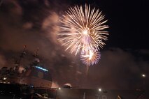 NAVAL AIR STATION PEARL HARBOR, Hawaii -- Fireworks erupt into a shower of colors behind the USS LAKE ERIE (CG 70), an Aegis-class guided missile cruiser based at Naval Station Pearl Harbor during the July 4 Celebration of Lights fireworks show. The day-long celebration was filled with live entertainment, exotic car display, a car show, pony rides, petting zoo, radio controlled car racing, games and much more. (U.S. Air Force photo by Staff Sgt. Mike Meares)  