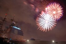 NAVAL AIR STATION PEARL HARBOR, Hawaii -- Fireworks erupt into a shower of colors behind the USS LAKE ERIE (CG 70), an Aegis-class guided missile cruiser based at Naval Station Pearl Harbor during the July 4 Celebration of Lights fireworks show. The day-long celebration was filled with live entertainment, exotic car display, a car show, pony rides, petting zoo, radio controlled car racing, games and much more. (U.S. Air Force photo by Staff Sgt. Mike Meares)  