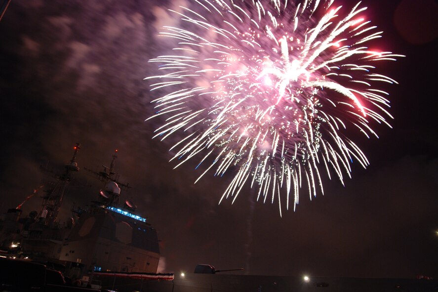 NAVAL AIR STATION PEARL HARBOR, Hawaii -- Fireworks erupt into a shower of colors behind the USS LAKE ERIE (CG 70), an Aegis-class guided missile cruiser based at Naval Station Pearl Harbor during the July 4 Celebration of Lights fireworks show. The day-long celebration was filled with live entertainment, exotic car display, a car show, pony rides, petting zoo, radio controlled car racing, games and much more. (U.S. Air Force photo by Staff Sgt. Mike Meares)  