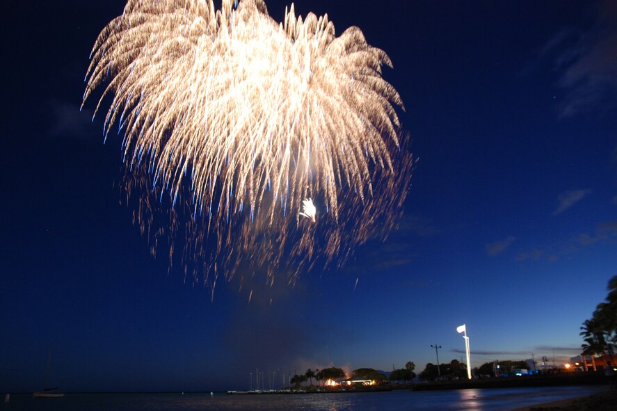 HICKAM AIR FORCE BASE, Hawaii -- Fireworks explode over Hickam Harbor during the grand finale of the All American Beach Blast July 4. The All American Beach Blast, hosted by 15th Services Squadron, began with camping and a movie under the stars July 3. The celebration continued July 4 with food booths, live entertainment, a kiddieland play area, bounce houses, swimming, as well as powerboat, sailboat and banana boat rides in the harbor. (U.S. Air Force photo/Staff Sgt. Mike Meares)