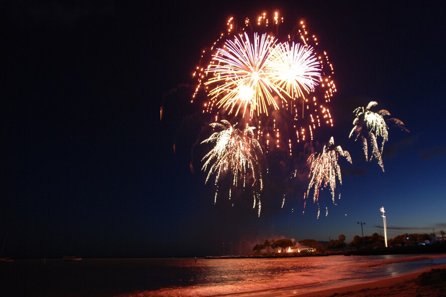 HICKAM AIR FORCE BASE, Hawaii -- Fireworks explode over Hickam Harbor during the grand finale of the All American Beach Blast July 4. The All American Beach Blast, hosted by 15th Services Squadron, began with camping and a movie under the stars July 3. The celebration continued July 4 with food booths, live entertainment, a kiddieland play area, bounce houses, swimming, as well as powerboat, sailboat and banana boat rides in the harbor. (U.S. Air Force photo/Staff Sgt. Mike Meares)