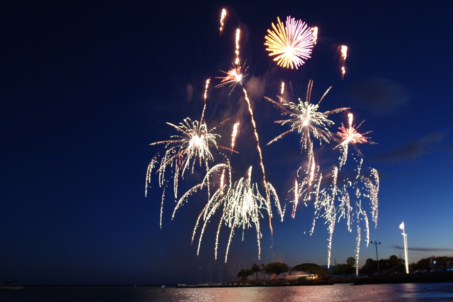 HICKAM AIR FORCE BASE, Hawaii -- Fireworks explode over Hickam Harbor during the grand finale of the All American Beach Blast July 4. The All American Beach Blast, hosted by 15th Services Squadron, began with camping and a movie under the stars July 3. The celebration continued July 4 with food booths, live entertainment, a kiddieland play area, bounce houses, swimming, as well as powerboat, sailboat and banana boat rides in the harbor. (U.S. Air Force photo/Staff Sgt. Mike Meares)
