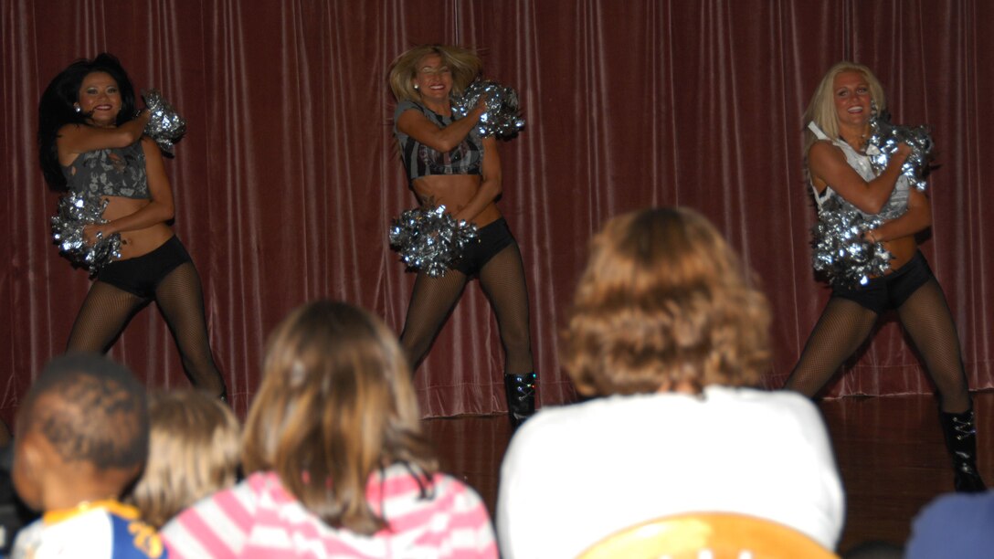 ANDERSEN AIR FORCE BASE, Guam - Members of the Tampa Bay Buccaneers cheerleading squad perform routines for more than 250 Airmen, Sailors and their families at the Top of the Rock June 25. After the performance, the cheerleaders signed autographs for more than an hour. The Buccaneers cheerleaders are the third set of National Football League cheerleaders to visit the base in 2009. (U.S. Air Force photo by Senior Airman Shane Dunaway)