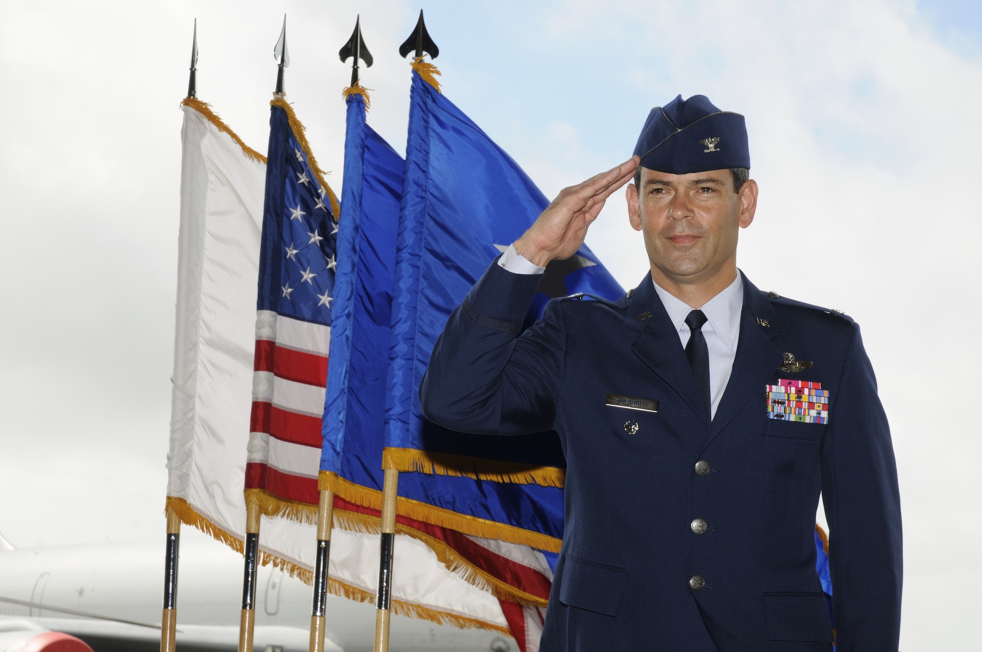 Col. Kenneth S. Wilsbach salutes to the Airmen of the 18th Wing as he assumes command of the wing during a change of command July 9 at Kadena Air Base, Japan. Brig. Gen. Brett Williams relinquished command earlier during the ceremony.
(U.S. Air Force photo/Airman 1st Class Chad Warren)            