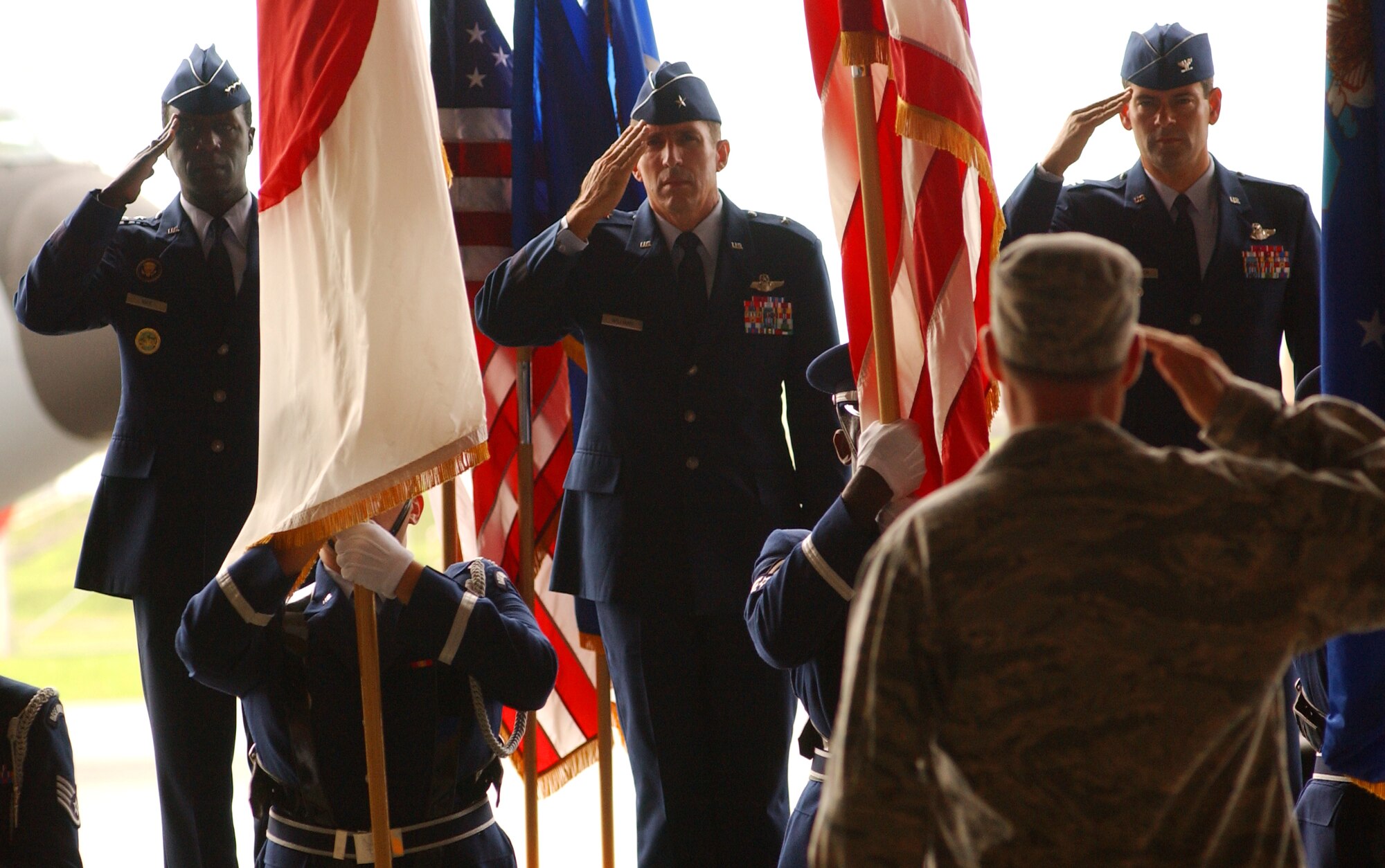 Lt. Gen. Edward Rice, commander of U.S. Forces Japan and 5th Air Force,  Gen. Brett Williams and Col. Kenneth Wilsbach salute the colors at the beginning of the change of command July 9 at Kadena Air Base, Japan. (U.S. Air Force photo/Tech. Sgt. Rey Ramon) 