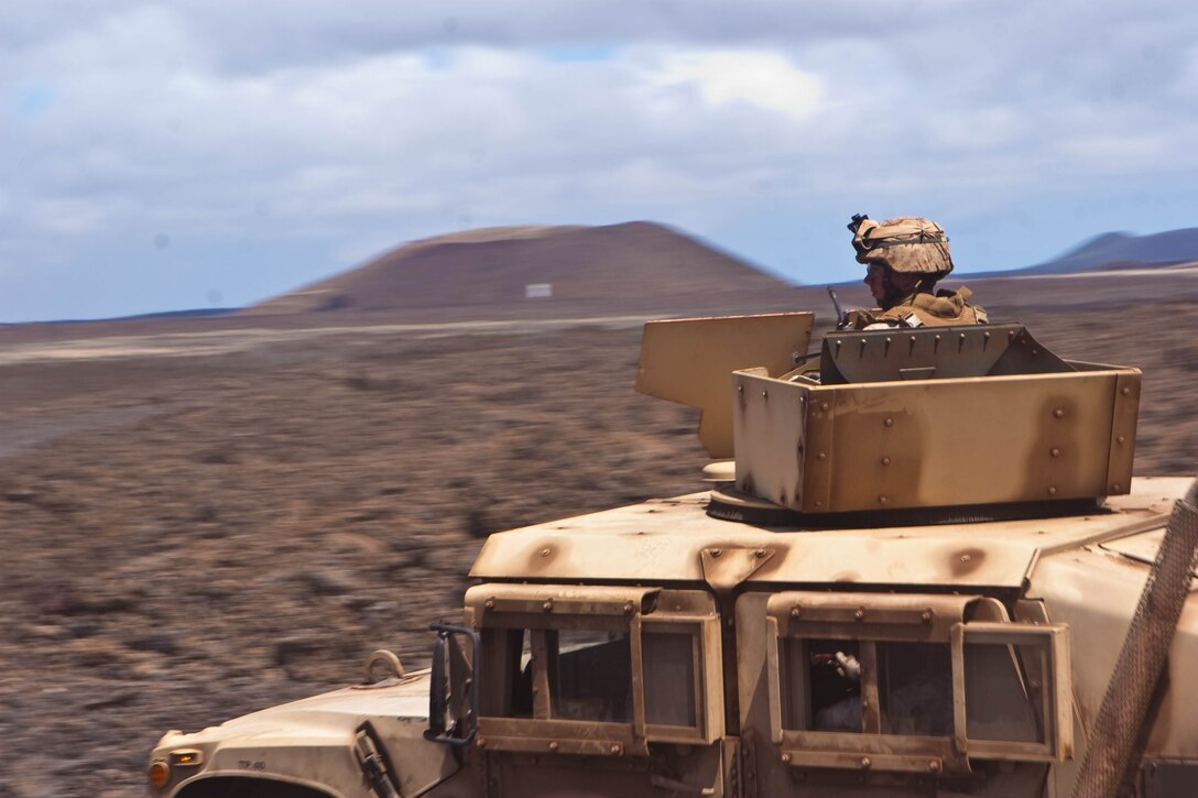 Marines from Alpha Company, 1/3, conduct live fire convoy  training on PTA’s Range 13, July 9. The Big Island allows the Marines to conduct live fire training unavailable on Oahu.