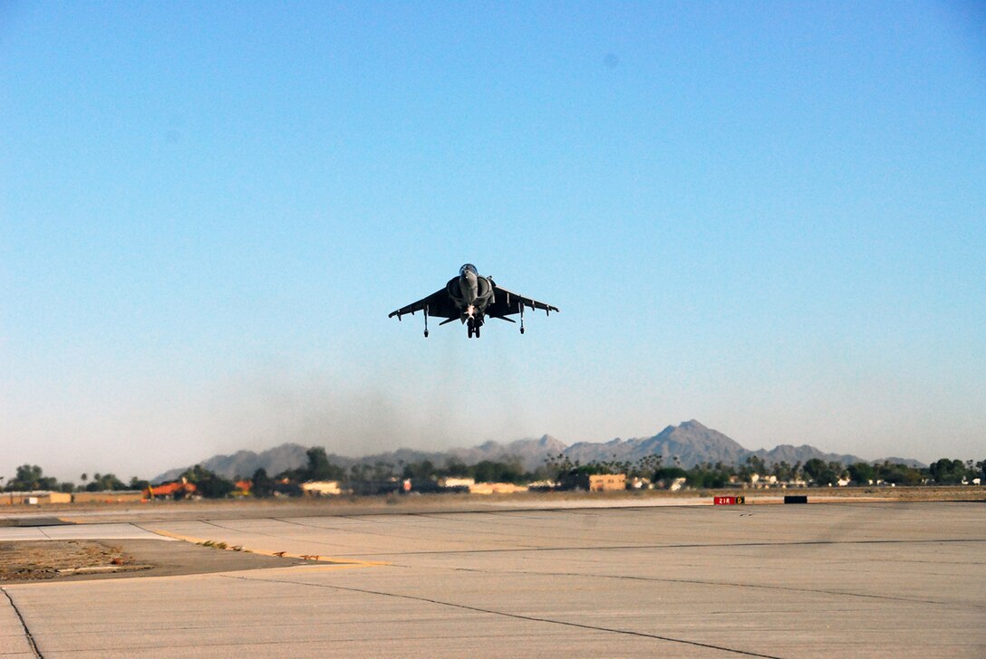 Capt. Jon Schaafsma, Marine Attack Squadron 311 pilot, prepares to land an AV-8B Harrier on the flight line of the Marine Corps Air Station in Yuma, Ariz., July 9, 2009, as part of his practice for the 25th annual Prairie Air Show held July 10-12 in Peoria, Ill. The Tomcats sent three Harriers to the show, one for ground display, one for the flight demonstration and one backup. "I think the main purpose of air shows is to show the public exactly what we are doing with their money, and they give us a chace to show off just a few of our abilities," said Lt. Col. Michael Gough, VMA-311 commanding officer.
